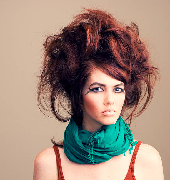 Messy high rise hair and crazy eye makeup on a model
