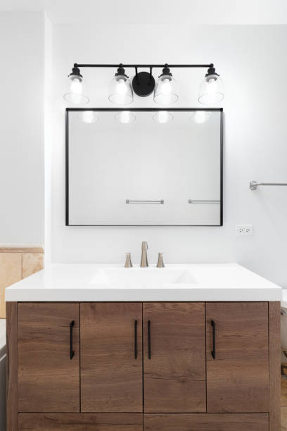 istock A bathroom's wood cabinet and white sink. 1468900593