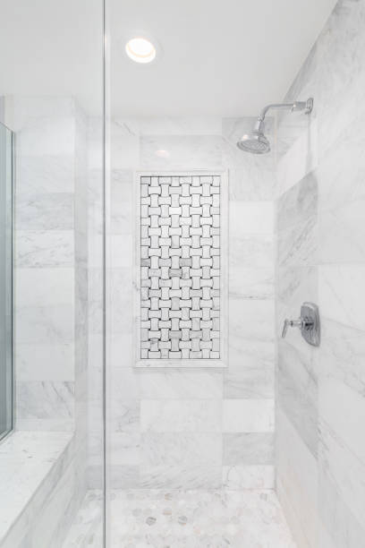 istock A shower with marble subway and hexagon tiles. 1468900872