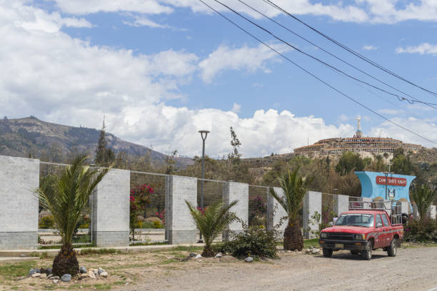 main facade of campo santo and entrance to the cemetery with small plants and next to the track, with some tourists, located in yungay, ancash - peru. january 2023 - rocio monasterio imagens e fotografias de stock