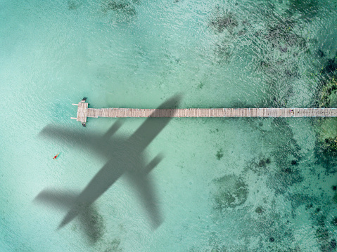 Airplane flies over a sea