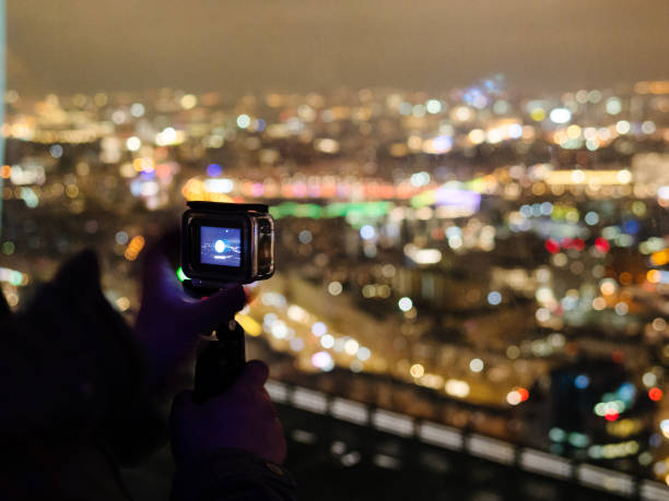 istock visitor films night city on mobile camera 1468902568