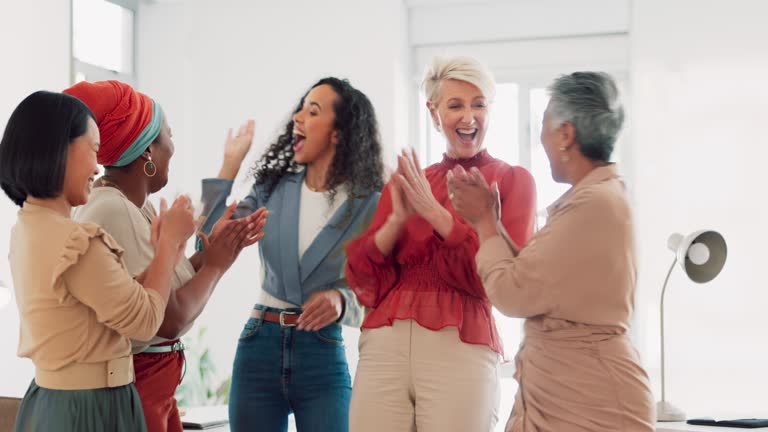 Collaboration, high five or applause and a business woman team standing with their hands in a huddle for celebration. Meeting, goal and wow with a female employee group celebrating success or a deal