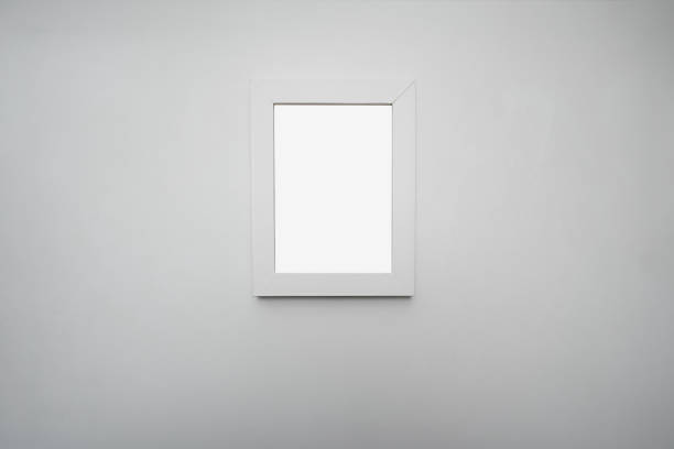 istock Empty white wooden photo frame hanging on wall at home or office 1468904011