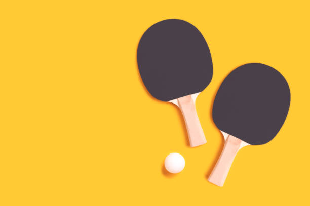 istock Tennis rackets and white ball on a yellow background. 1468909328