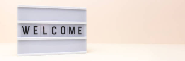 istock Banner with word Welcome. Lightbox with letters in front of beige background. 1468911270
