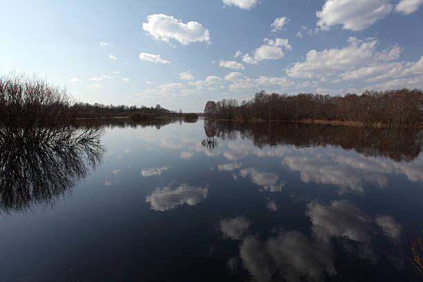 istock Reflexion of clouds in water 146891135