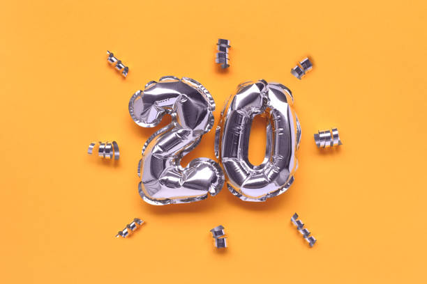 istock Number twenty silver balloons with ribbons confetti. 1468912505
