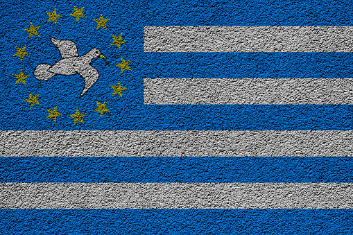 Flag of the Federal Republic of Ambazonia on a textured background. Concept collage.