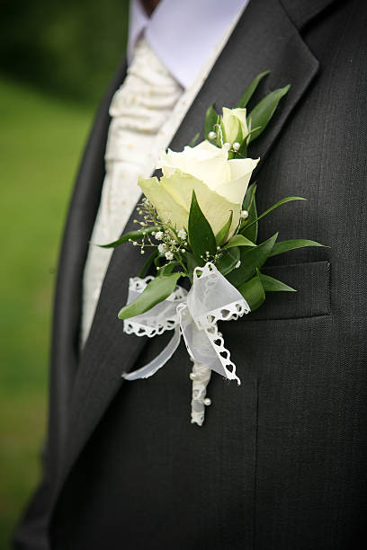 Rose on groom's suit stock photo