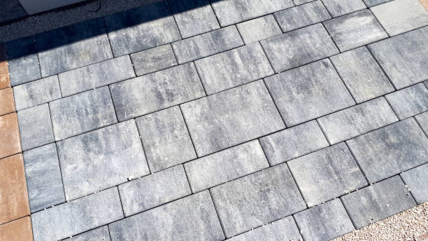 istock Gray paving stones. Paving surface road. Texture made of big gray cement bricks. Brick stone street road - pavement texture effect 1468919064