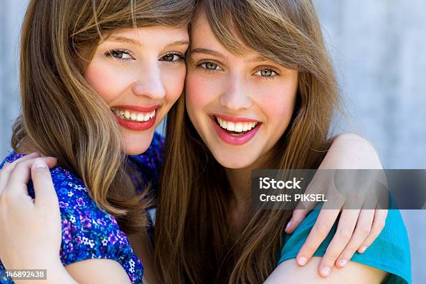 Two Women Hugging And Smiling Stock Photo - Download Image Now - Adult, Beautiful People, Beauty