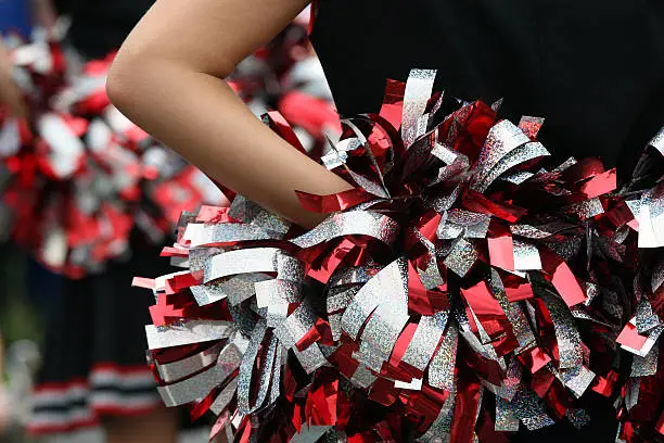 young cheerleader with red silver & black pompom