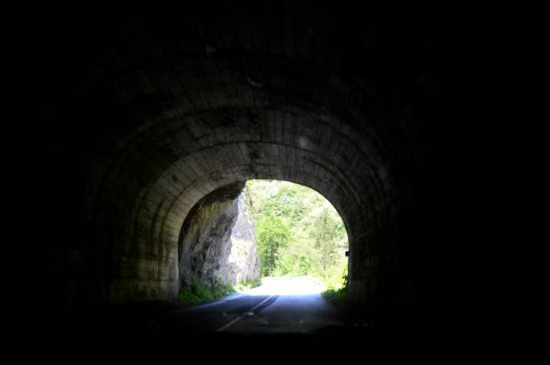 istock road tunnel in the rock 1468925166