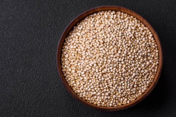 istock Wholesome raw quinoa in a bowl on a dark concrete background 1468925212