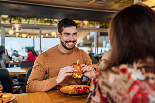 istock Young man enjoying a delicious burger 1468927043