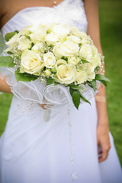 istock Bride holds a wedding bouquet of roses 146892841