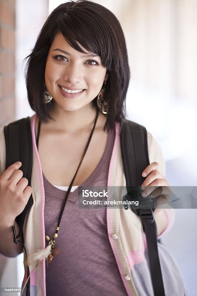 A mixed race college student with a backpack A portrait of a mixed race college student at campus Adolescence Stock Photo