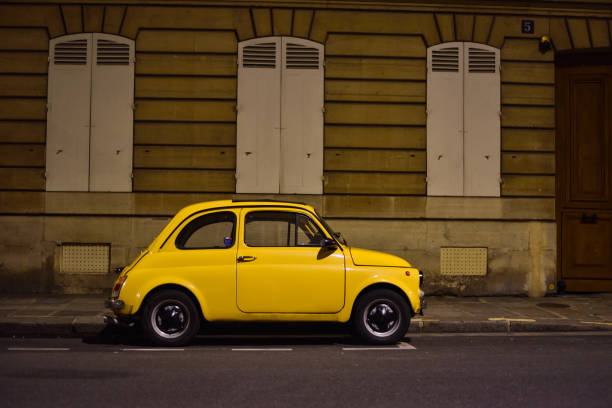 istock Small Yellow Old Timer Car in Paris, France 1468930411