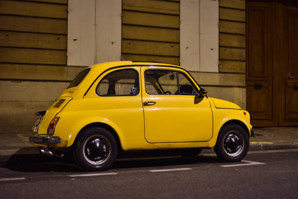 istock Small Yellow Old Timer Car in Paris, France 1468930412