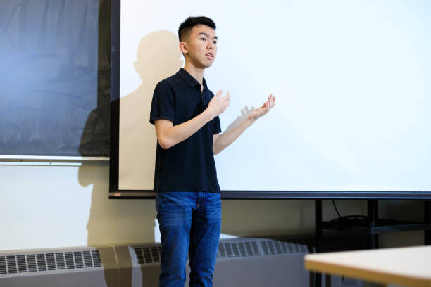istock A teenage student giving a presentation speech in a classroom 1468932299