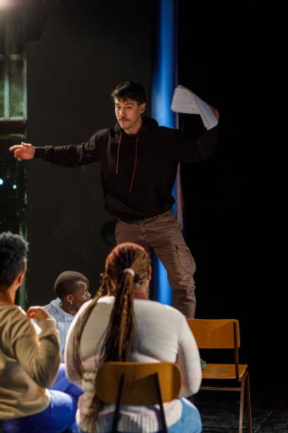 istock Actors Rehearsing With Scripts On Stage In Theatre 1468933653