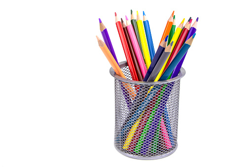 A set of color pencils in a cup isolated on a white background. Copy space. A School stuff.Drawing supplies.