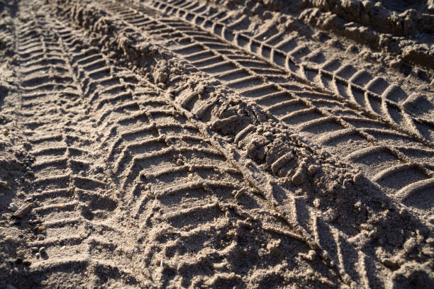 istock Vehicle tire tracks in the sand 1468938011