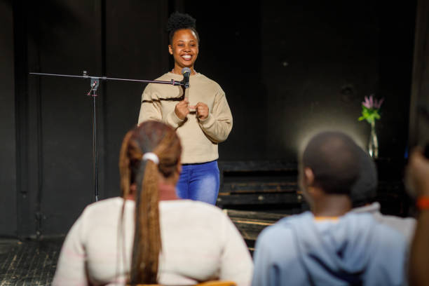 istock Smiling Stand Up Comedian On Stage 1468938805