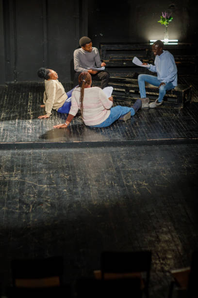 istock Group Of Black Drama Students Doing An Improv Exercise In An Acting Class 1468939500