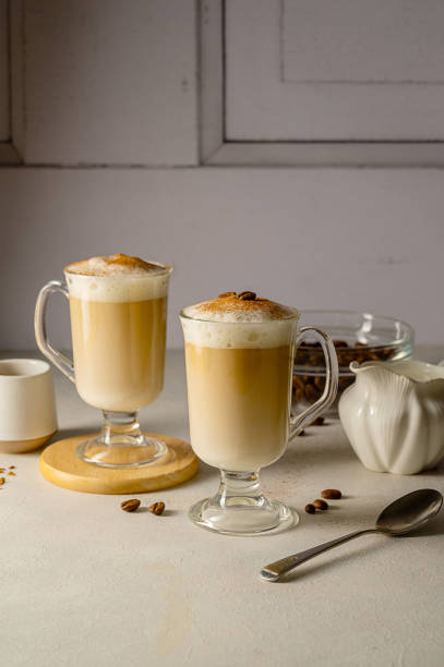 istock Two cups with coffee drink, latte or mocha with milk foam and cinnamon 1468940025
