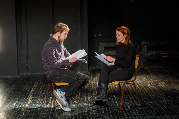 istock Actors Rehearsing With Scripts On Stage In Theatre 1468940999