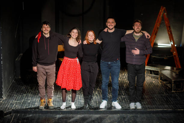 Actors Taking A Bow On Stage After Performance Actors taking a bow on stage after performance in theater curtain call stock pictures, royalty-free photos & images