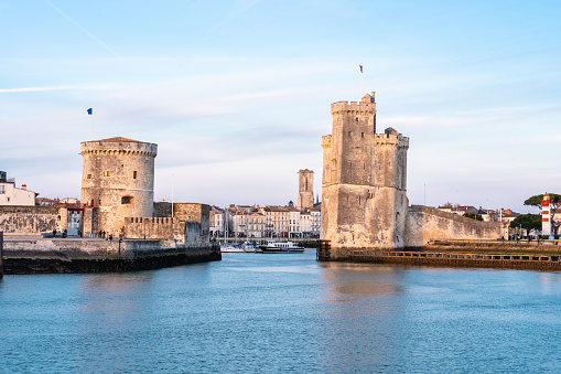 The port of La Rochelle during the blue hour. Panorama of the skyline with its famous towers.