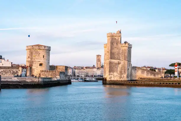 The port of La Rochelle during the blue hour. Panorama of the skyline with its famous towers.