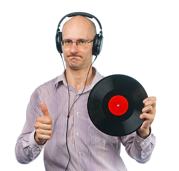 istock Music lover in headphones shows old disc 146895090
