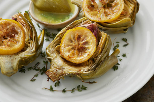 Roasted Artichokes with Olive Oil, Garlic, Salt, Pepper. Lemon, Fresh Thyme and a Garlic Butter Dip