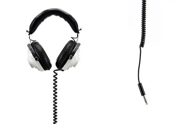 Photo of retro headphones isolated on white with jack