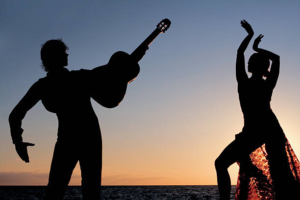spanish dancers dancing outdoors silhouette of spanish dancers dancing outdoors with guitar. flamenco dancing photos stock pictures, royalty-free photos & images
