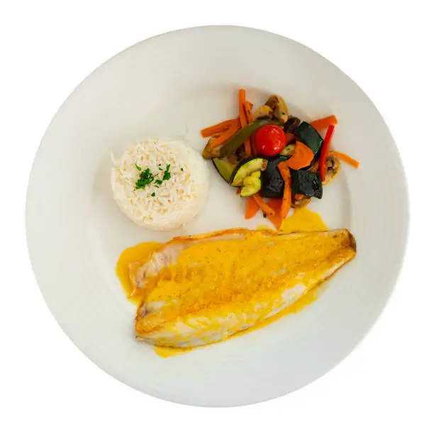 Photo of Sea bass fillet with curry sauce and basmati rice