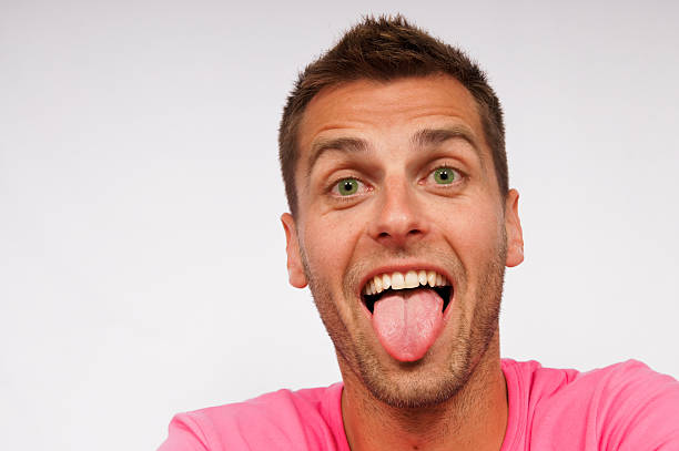 istock Young man and his tongue 146896413