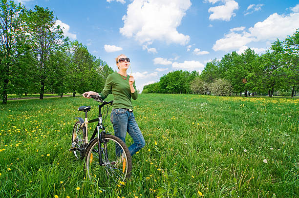 Woman with bicycle stock photo