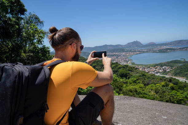 istock Man relaxing after hiking and enjoying the view 1468968411