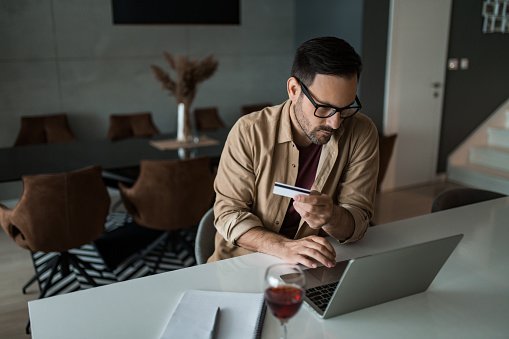 Man Using Online Program Young Man Using Online Banking At Home Stock Photo - Download Image Now ...
