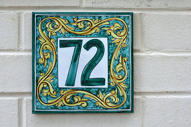 istock tiled number seventy two sign for home 146897060
