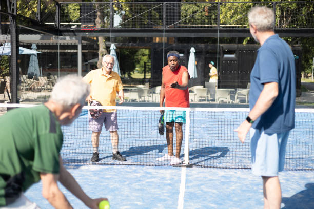 istock Senior friends playing padel for the weekend 1468973165