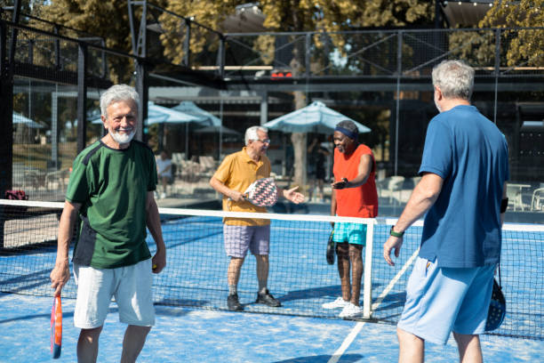 istock Senior friends playing padel for the weekend 1468973169