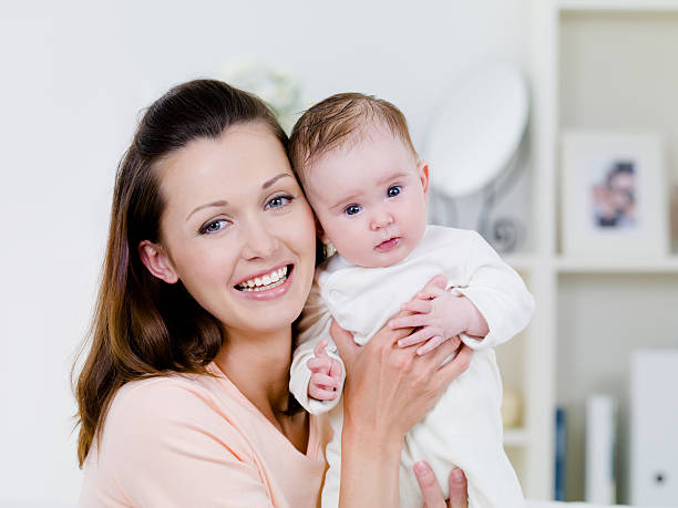 istock Happy woman with newborn child 146897327