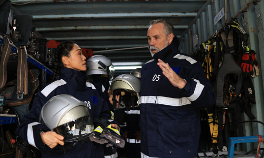 Male and Female Firefighters wearing PPE uniform  ,Fireman wearing firefighter turnouts and helmet