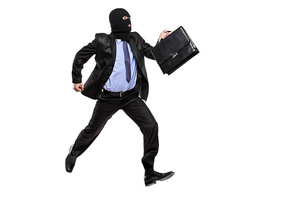 istock Burglar with robbery mask running away 146898306